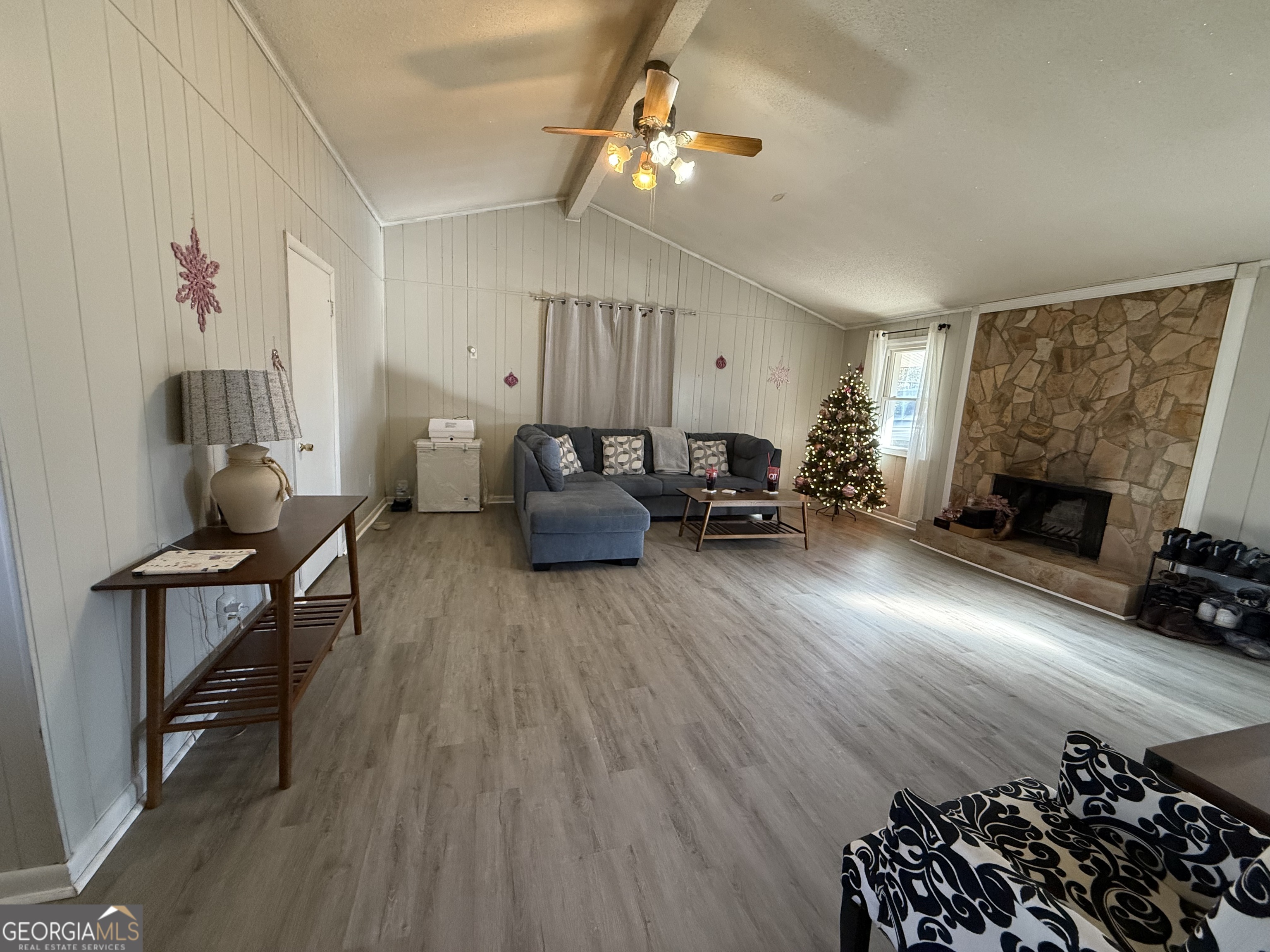 102 Hemlock Street Warner Robins, GA 31093 - Photo 28 of 32 a living room with furniture and a fireplace