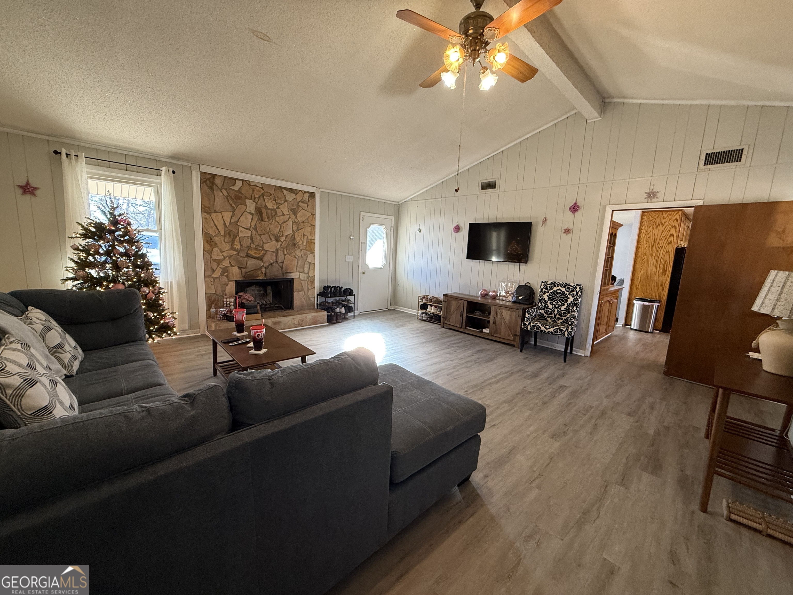 102 Hemlock Street Warner Robins, GA 31093 - Photo 29 of 32 a living room with furniture and a flat screen tv