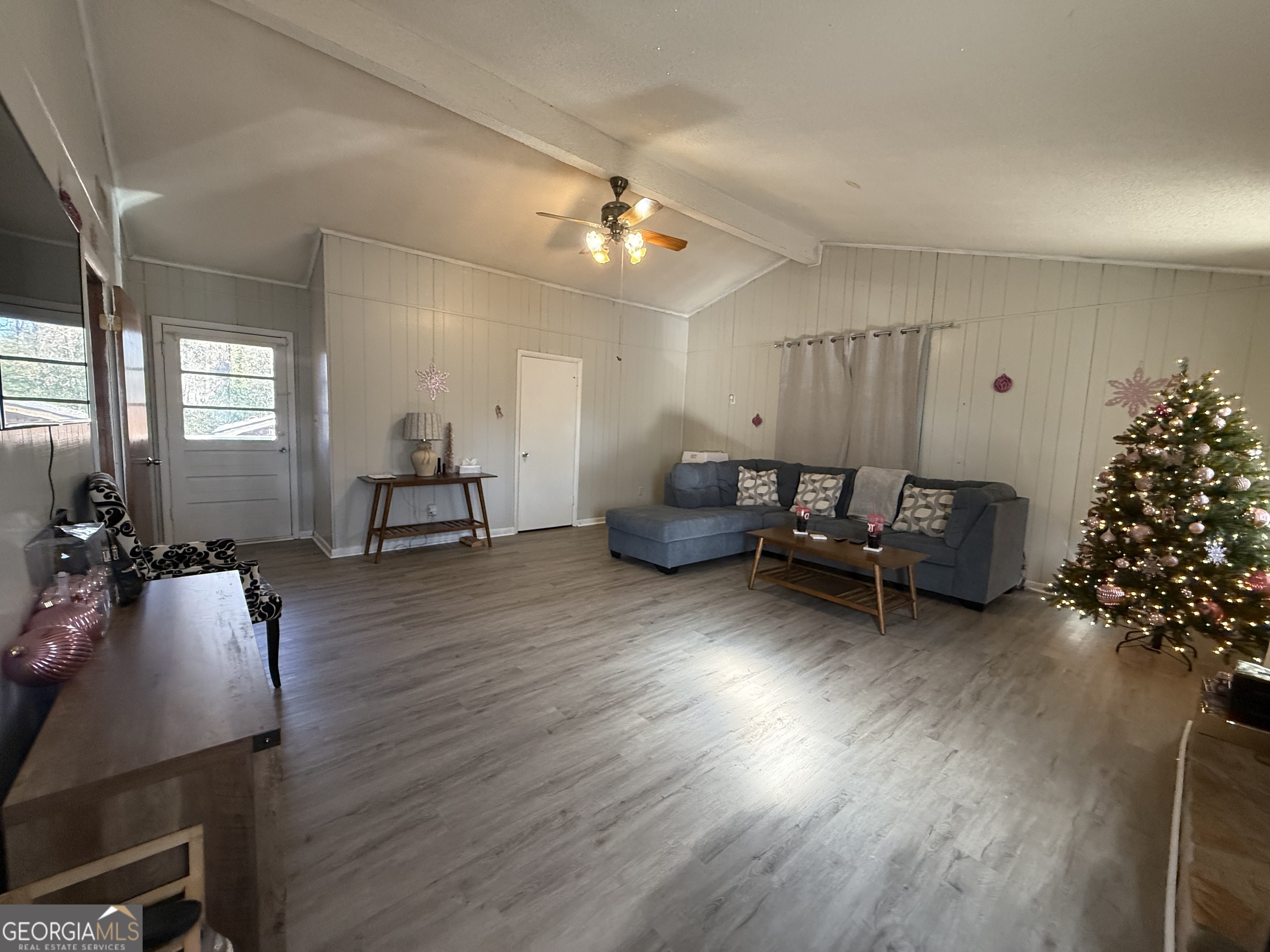 102 Hemlock Street Warner Robins, GA 31093 - Photo 30 of 32 a living room with furniture and wooden floor