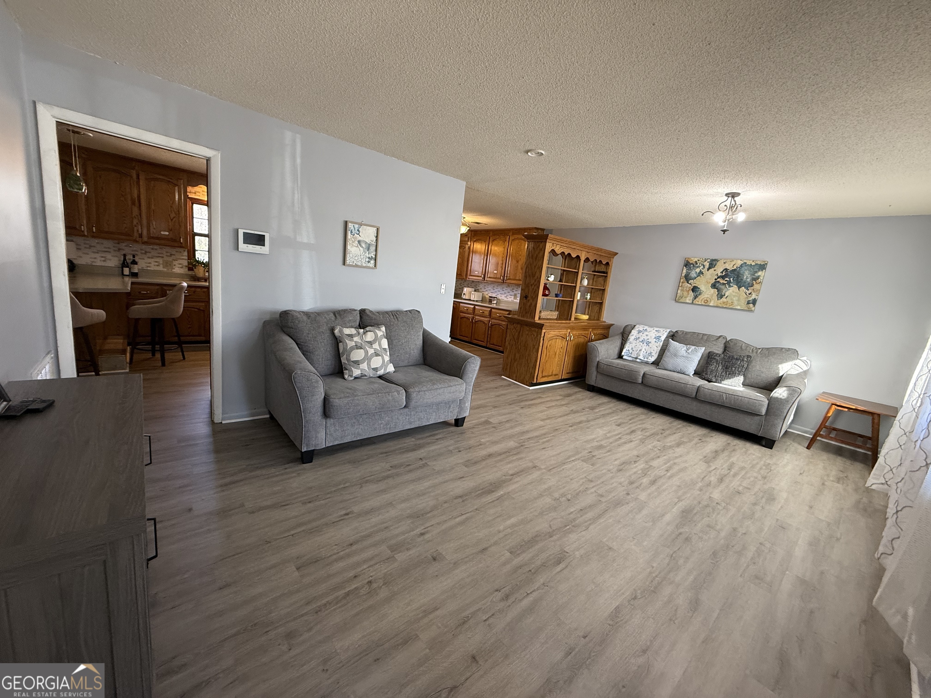 102 Hemlock Street Warner Robins, GA 31093 - Photo 3 of 32 a living room with furniture and a wooden floor