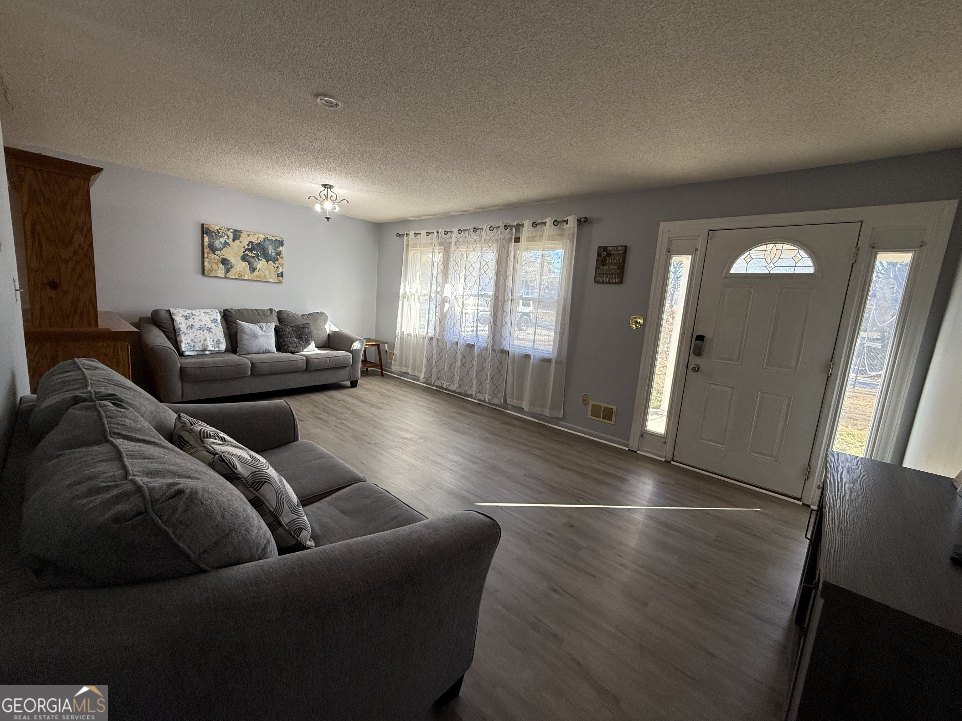 102 Hemlock Street Warner Robins, GA 31093 - Photo 4 of 32 a living room with furniture and a hard wood floor
