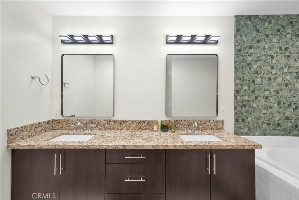 21 Gramercy, Unit 220 Irvine, CA 92612 - Photo 17 of 43 a bathroom with a sink and a mirror