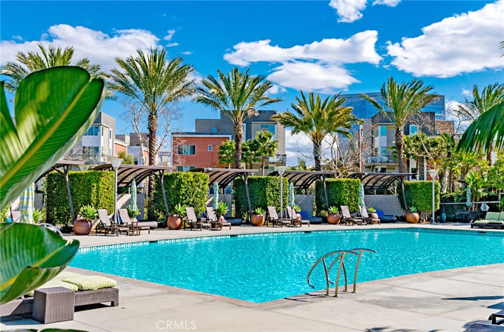 21 Gramercy, Unit 220 Irvine, CA 92612 - Photo 32 of 43 a front view of multi story residential apartment building with a garden and plants