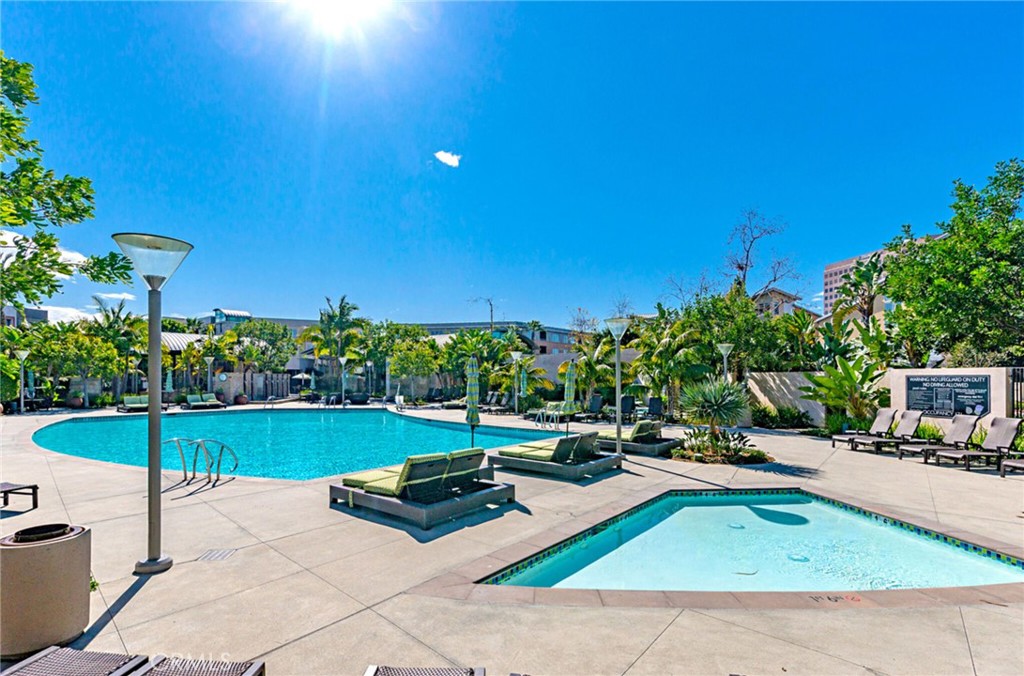 21 Gramercy, Unit 220 Irvine, CA 92612 - Photo 35 of 43 a view of a tennis ground with large trees