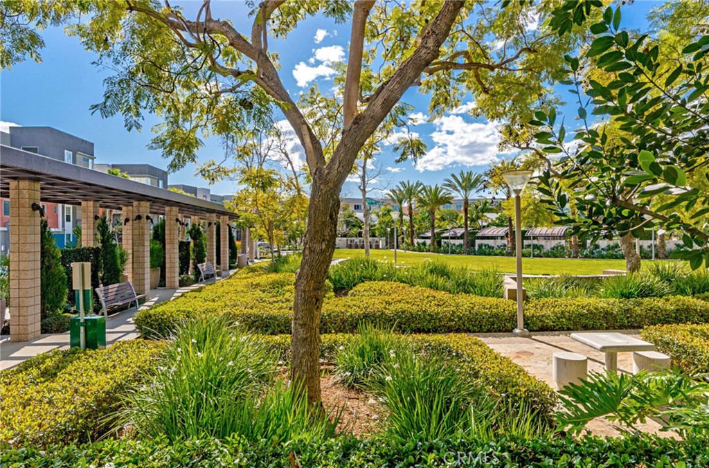 21 Gramercy, Unit 220 Irvine, CA 92612 - Photo 40 of 43 a view of a garden with a tree