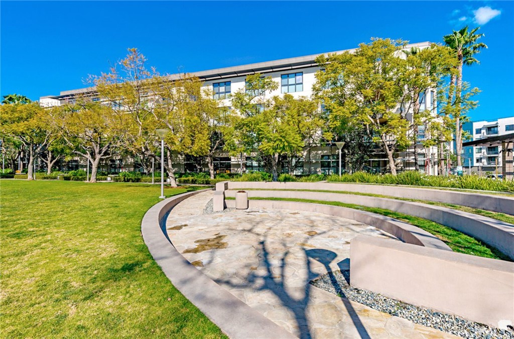21 Gramercy, Unit 220 Irvine, CA 92612 - Photo 42 of 43 a view of a swimming pool with a yard