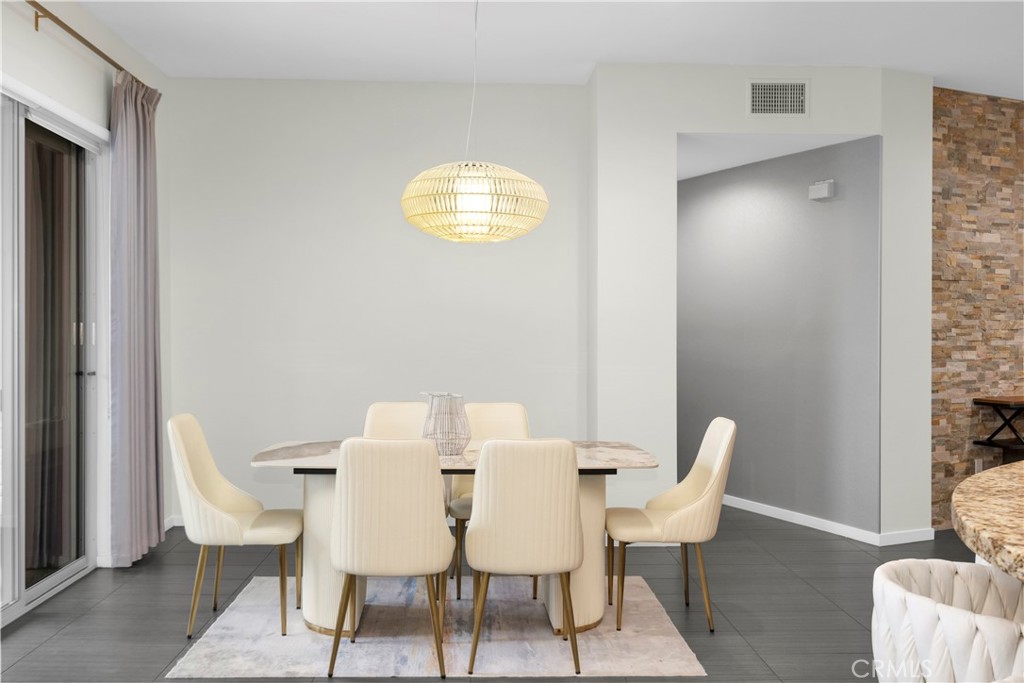 21 Gramercy, Unit 220 Irvine, CA 92612 - Photo 8 of 43 a view of a dining room with furniture and wooden floor