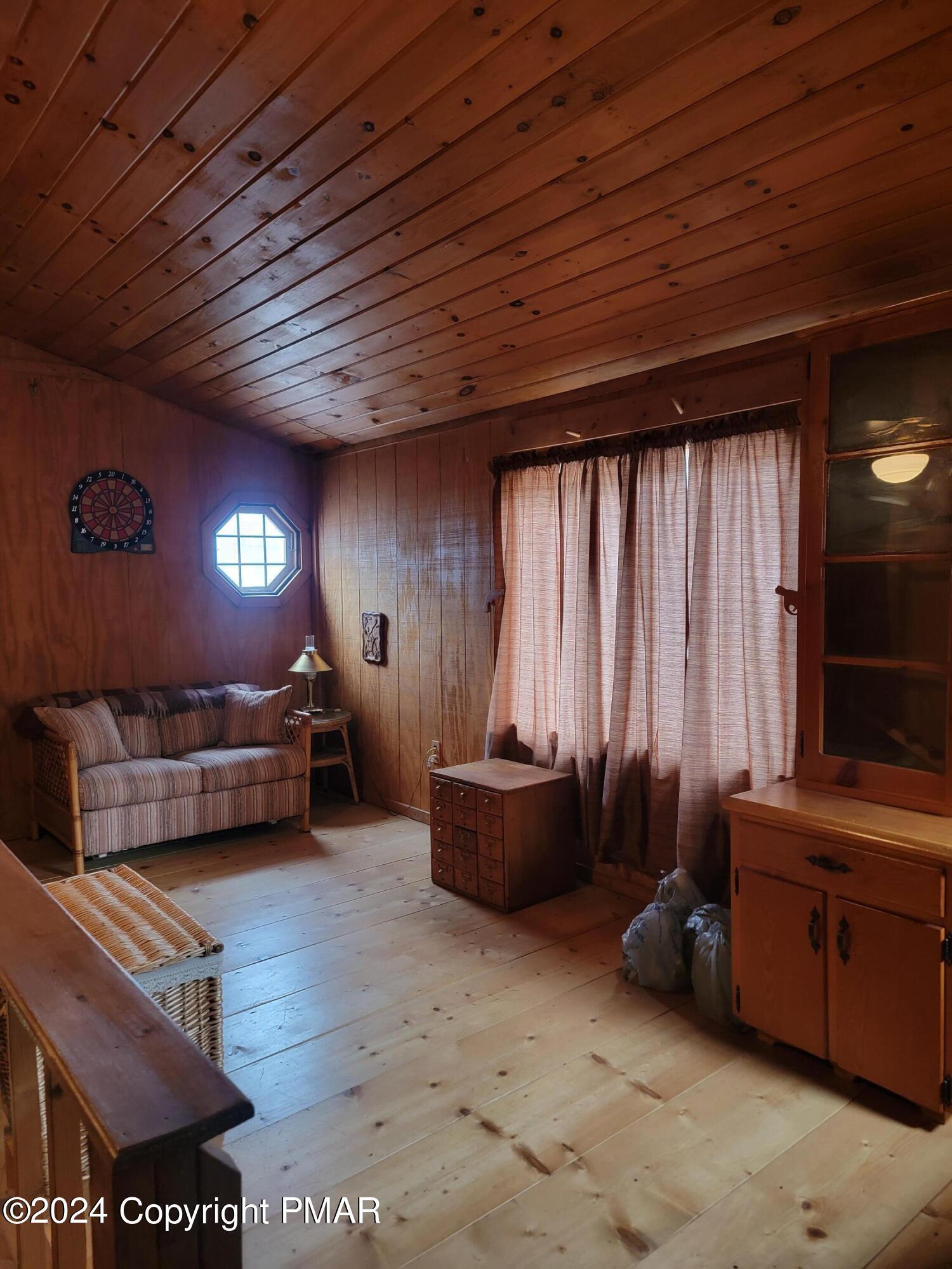 491 Klinger Hill Road Benton, PA 17814 - Photo 17 of 76 a living room with furniture and a window