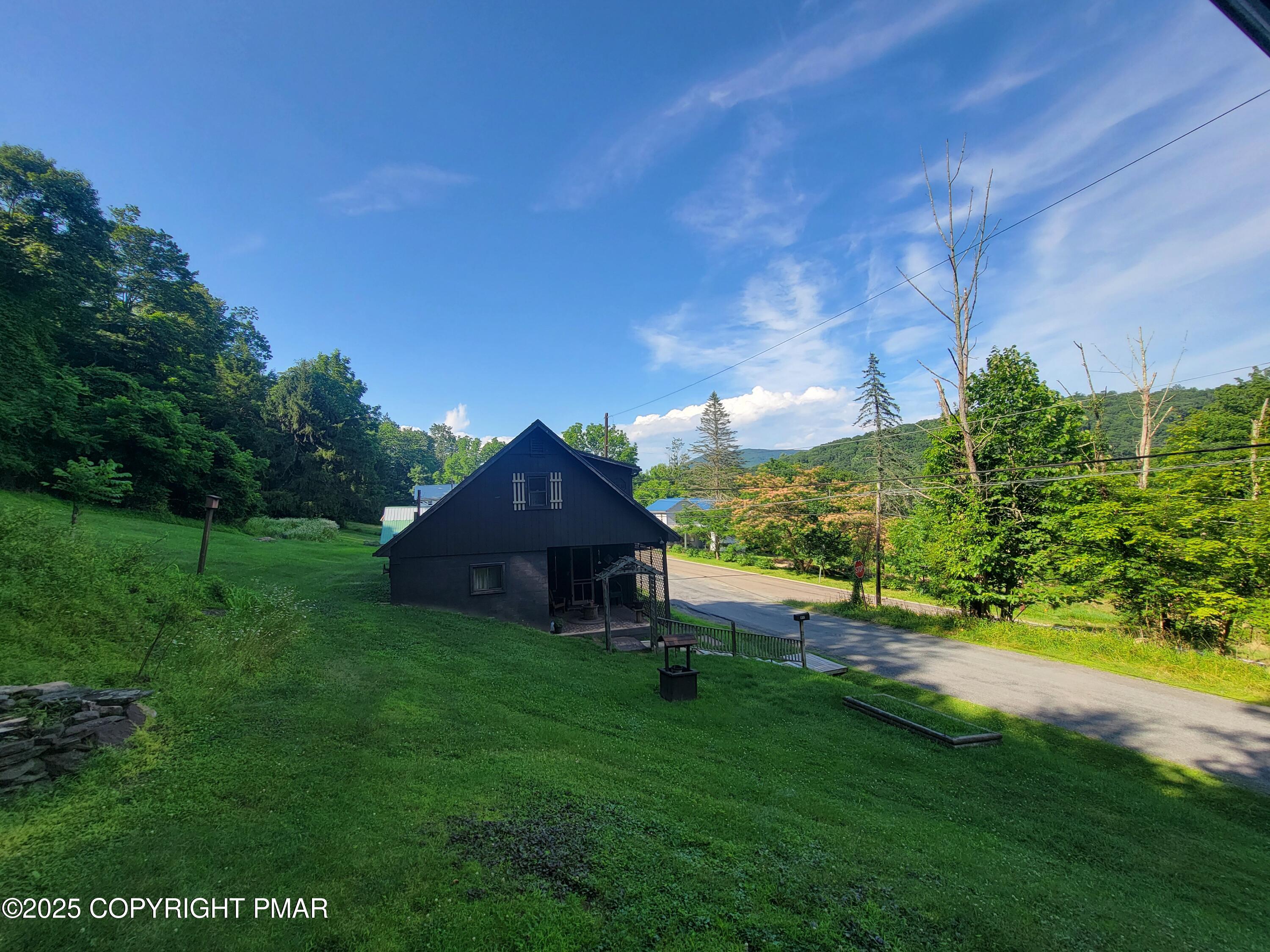491 Klinger Hill Road Benton, PA 17814 - Photo 2 of 76 a view of a garden with a bench