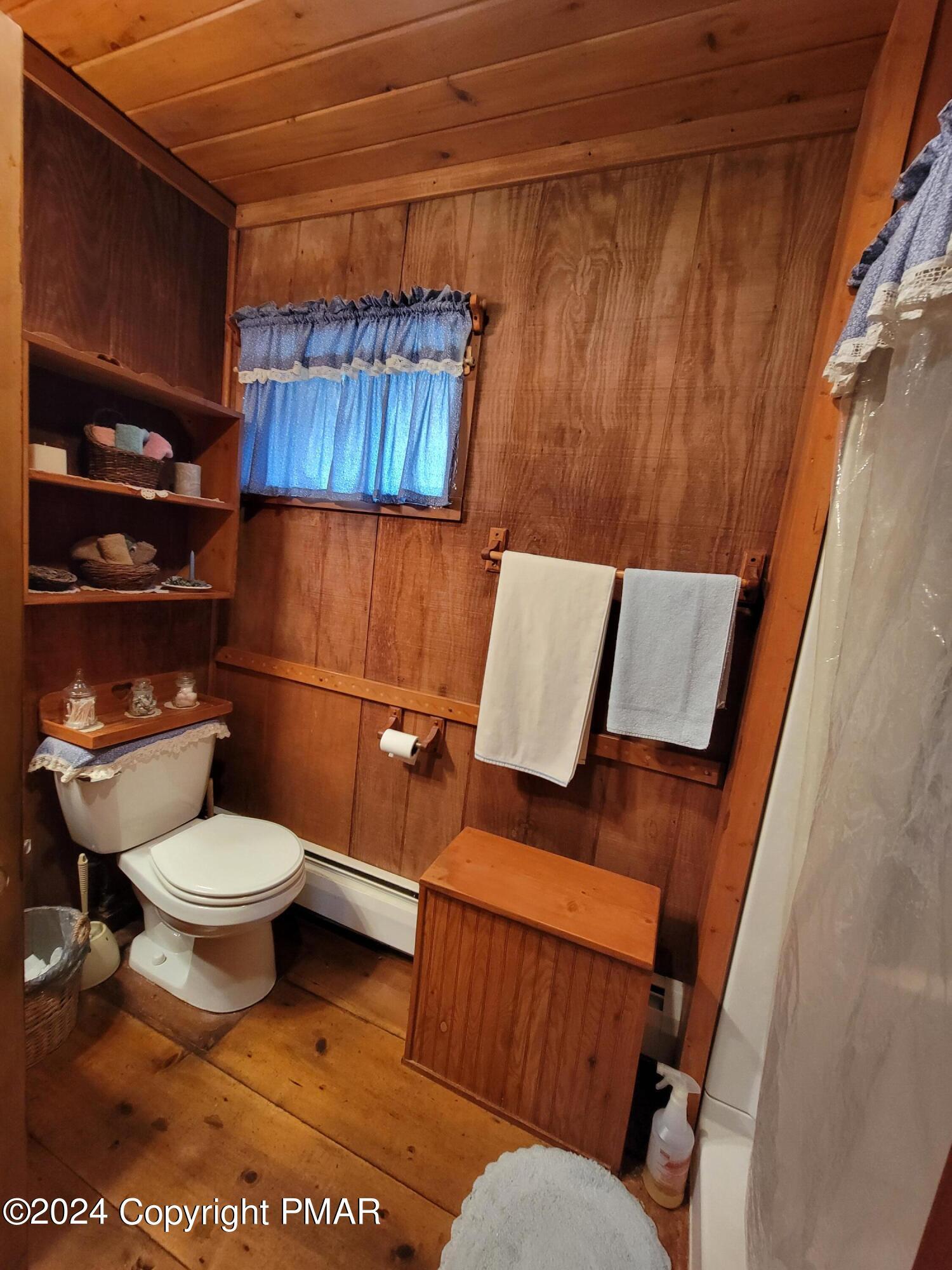 491 Klinger Hill Road Benton, PA 17814 - Photo 35 of 76 a toilet sitting next to a bathroom sink and a mirror