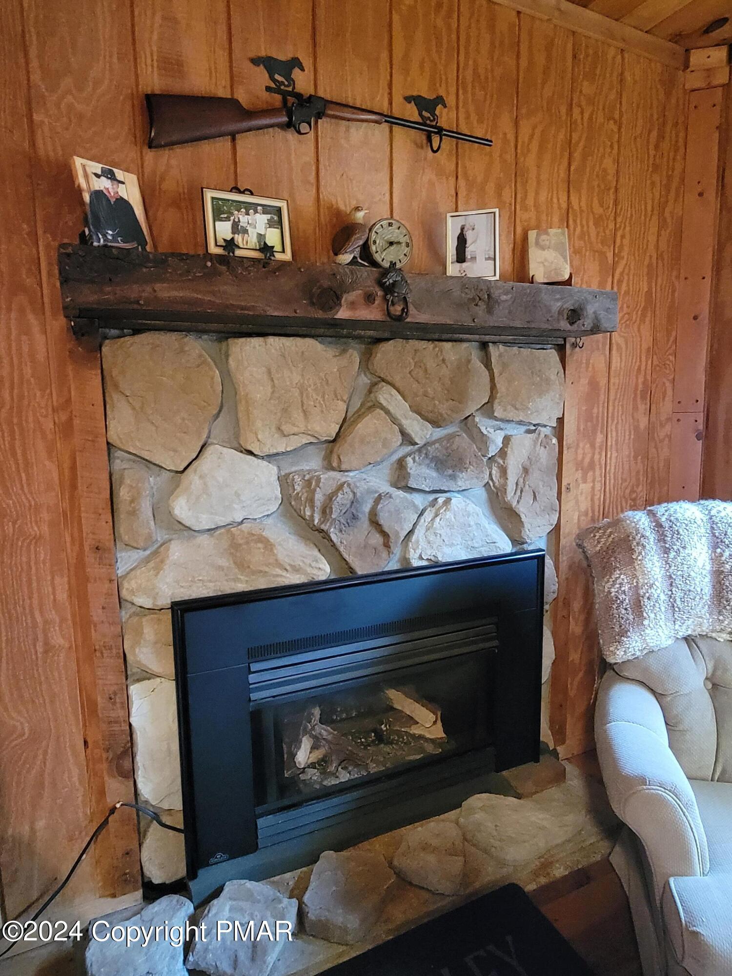 491 Klinger Hill Road Benton, PA 17814 - Photo 42 of 76 a living room with furniture and a fireplace