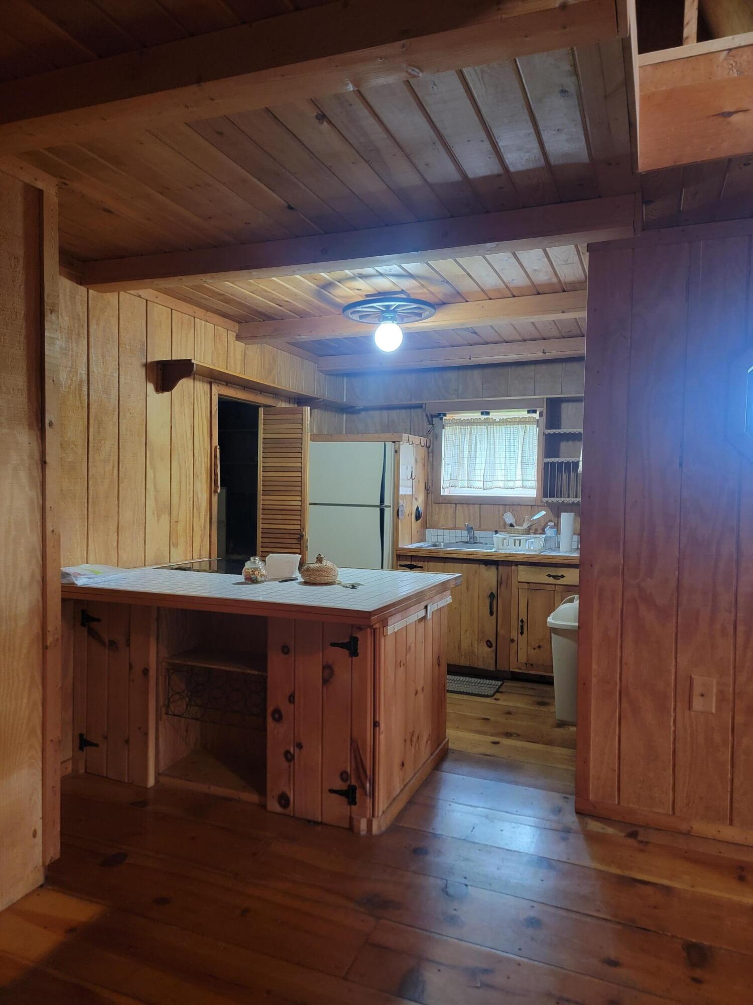 491 Klinger Hill Road Benton, PA 17814 - Photo 52 of 76 a kitchen with cabinets and wooden floor