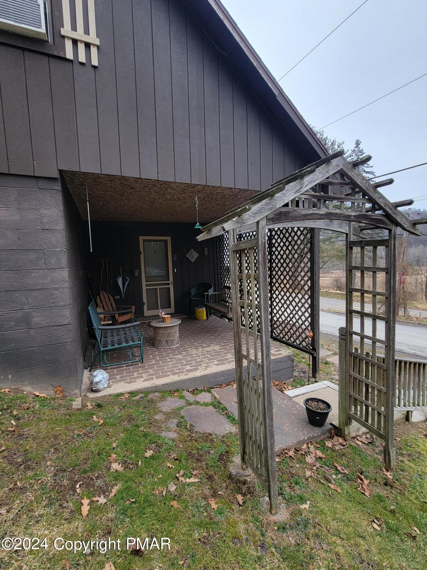 491 Klinger Hill Road Benton, PA 17814 - Photo 70 of 76 a view of a lounge chair and table in the patio