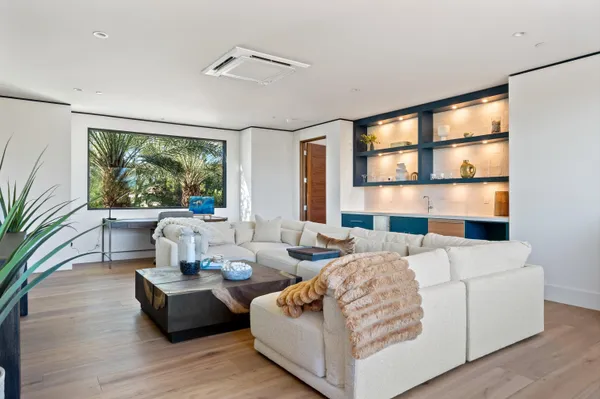 a living room with furniture and a large window