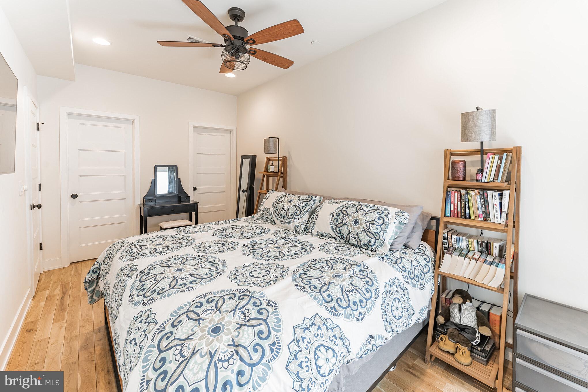 614 Master Street, Unit 1 Philadelphia, PA 19122 - Photo 22 of 28 a bedroom with a bed and a book shelf