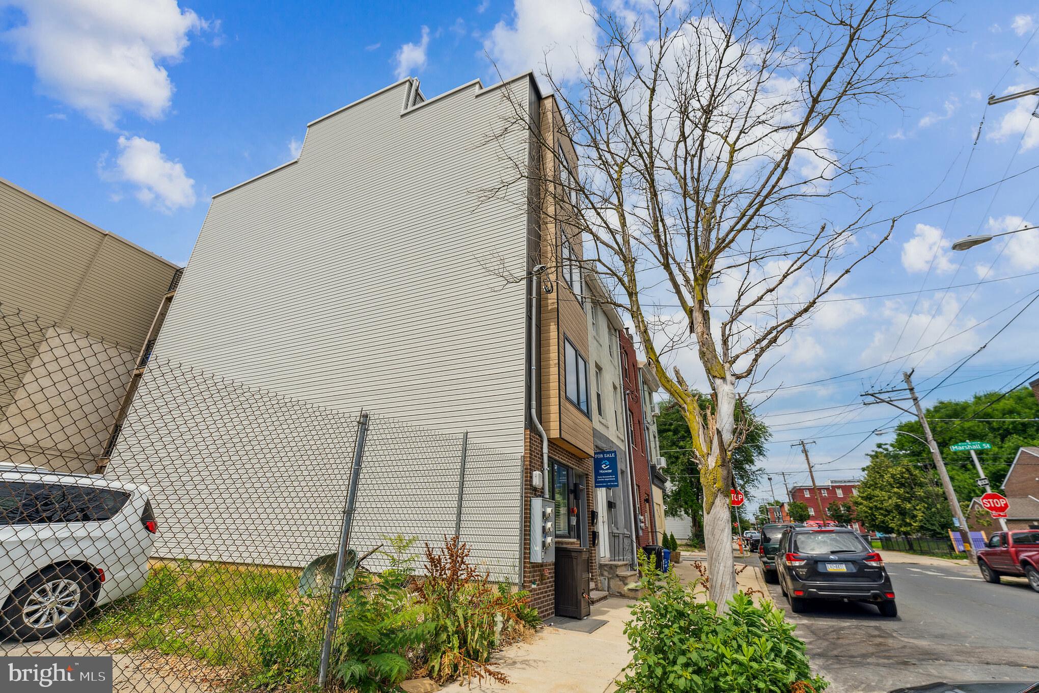 614 Master Street, Unit 1 Philadelphia, PA 19122 - Photo 28 of 28 a view of a street with cars parked on the road