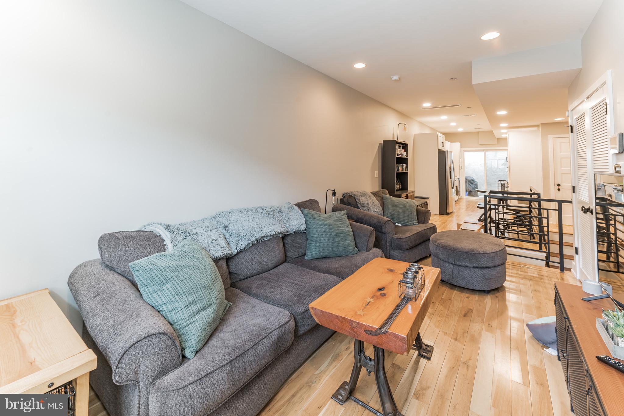 614 Master Street, Unit 1 Philadelphia, PA 19122 - Photo 6 of 28 a living room with furniture and a table