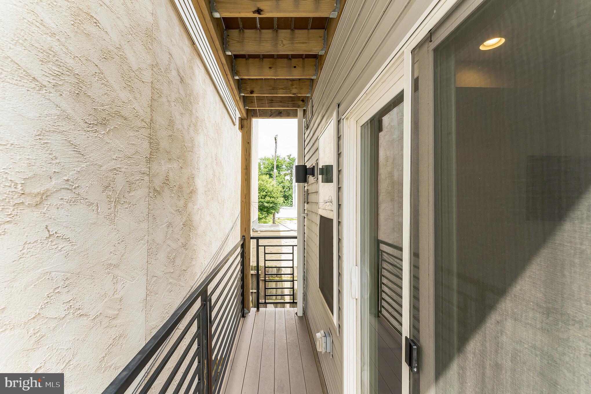 614 Master Street, Unit 1 Philadelphia, PA 19122 - Photo 10 of 28 a view of balcony and wooden floor