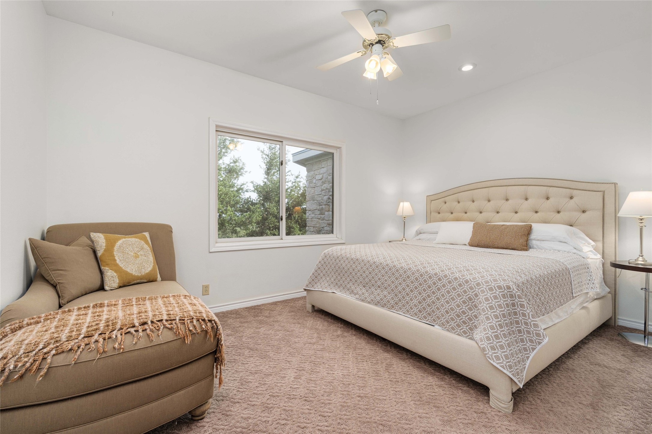 2102 Paisano Road Austin, TX 78746 - Photo 13 of 26 Carpeted bedroom featuring a ceiling fan and recessed lighting