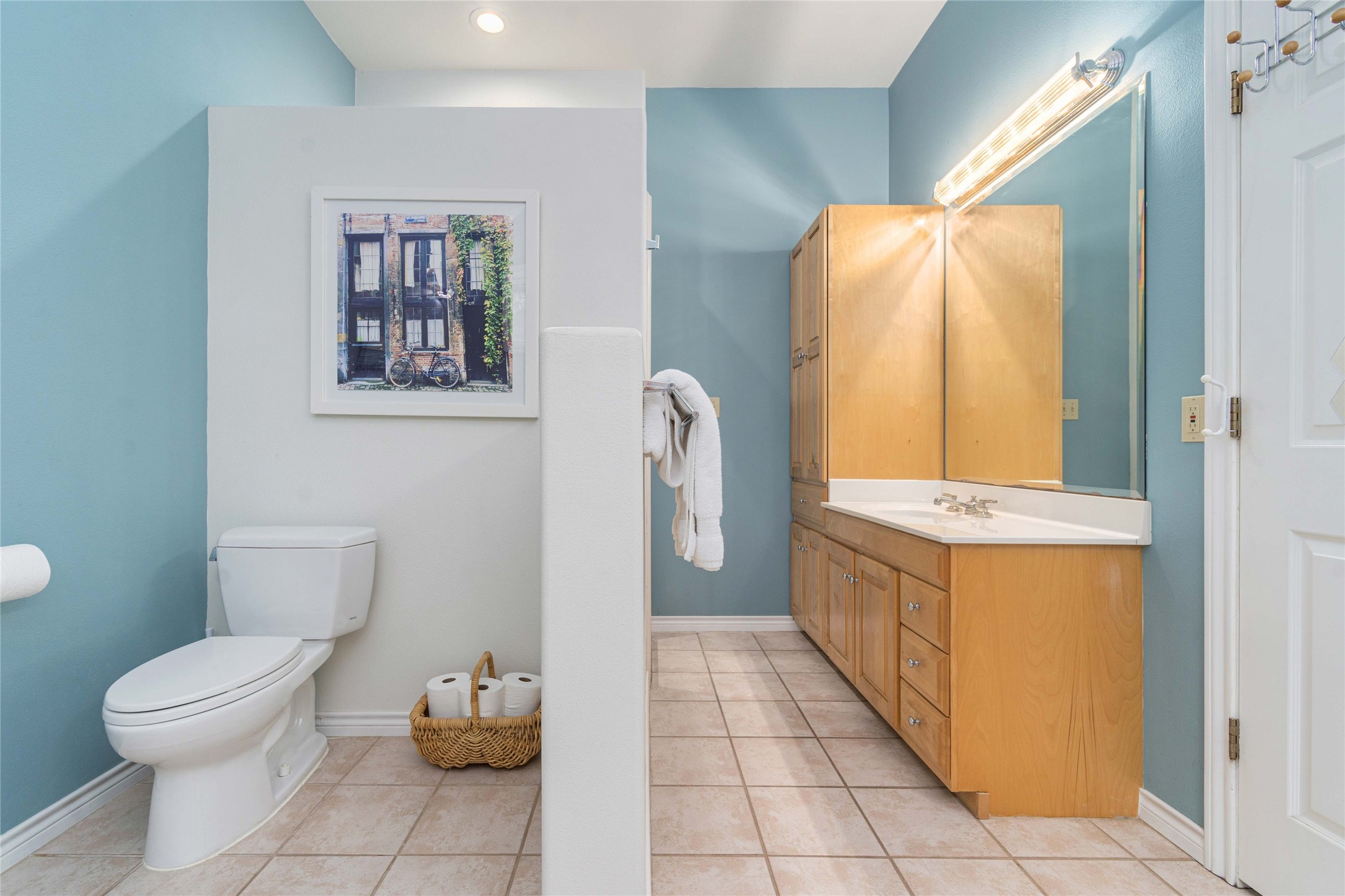 2102 Paisano Road Austin, TX 78746 - Photo 15 of 26 Bathroom with vanity and light tile patterned floors