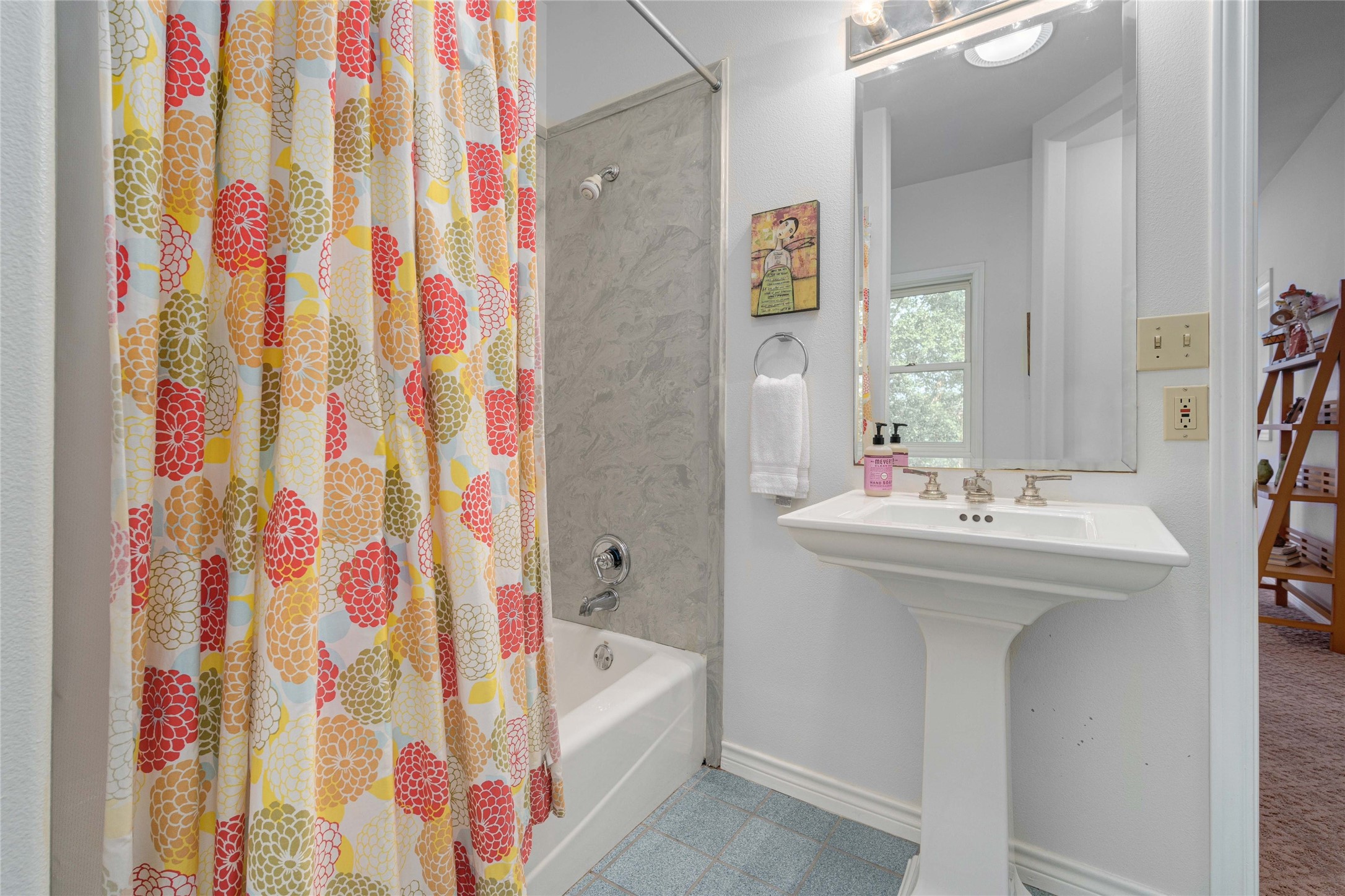 2102 Paisano Road Austin, TX 78746 - Photo 18 of 26 Bathroom with shower / bath combo with shower curtain and baseboards