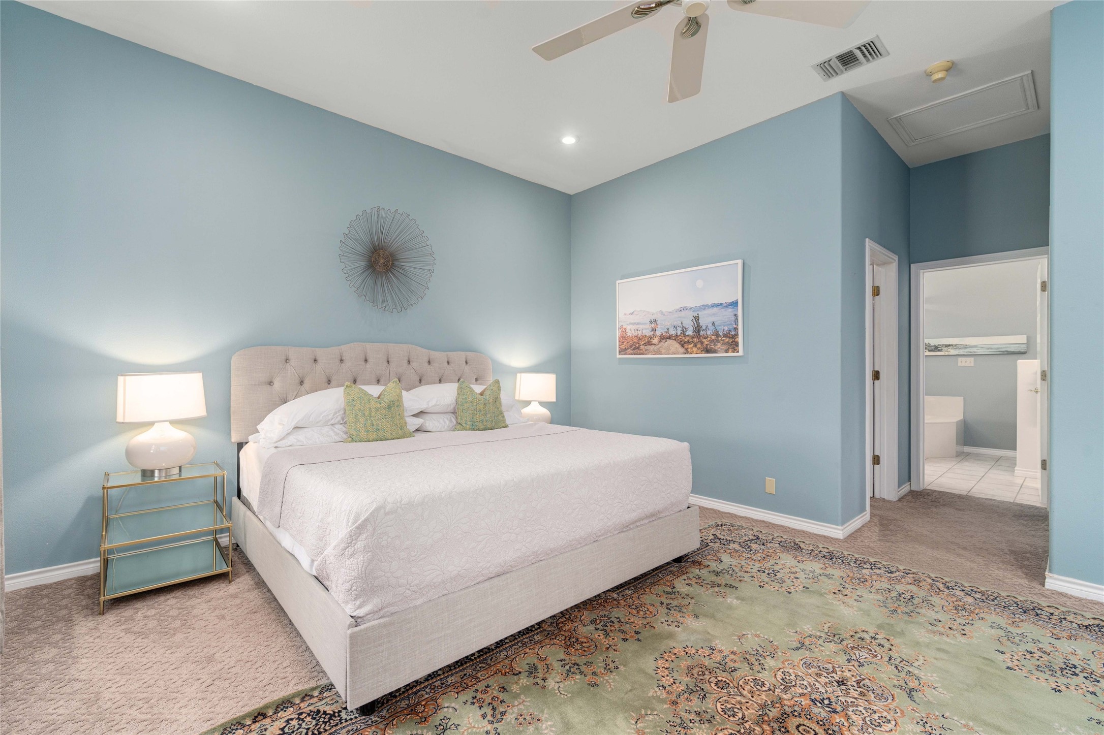 2102 Paisano Road Austin, TX 78746 - Photo 24 of 26 Carpeted bedroom featuring ceiling fan, ensuite bath, and recessed lighting