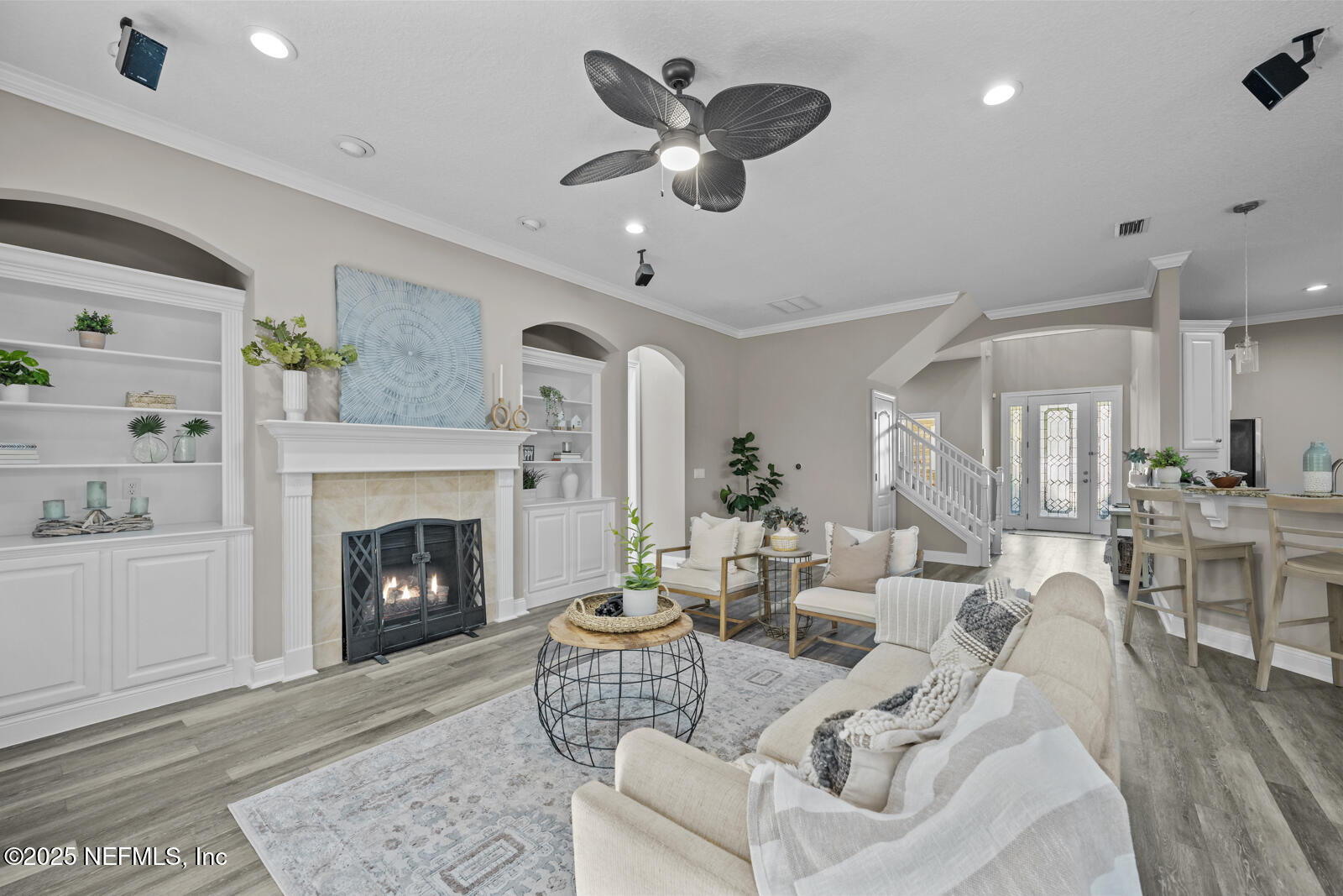 165 St John's Forest Boulevard St. Johns, FL 32259 - Photo 12 of 103 a living room with furniture a fireplace and a chandelier