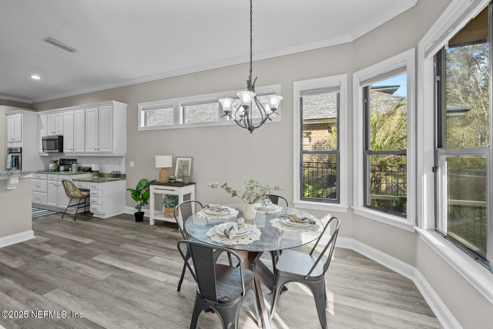 165 St John's Forest Boulevard St. Johns, FL 32259 - Photo 22 of 103 a view of a dining room with furniture a chandelier and wooden floor