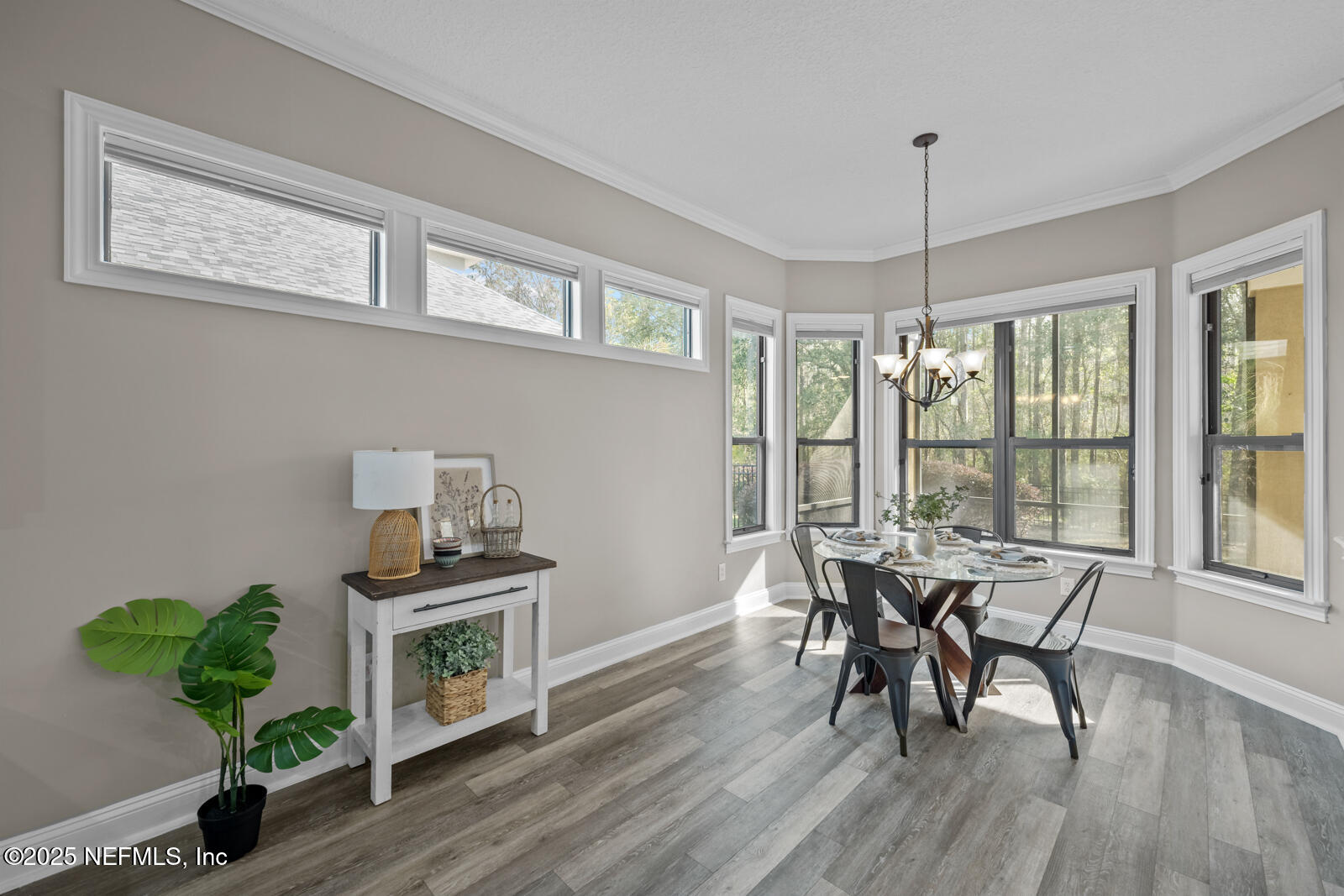 165 St John's Forest Boulevard St. Johns, FL 32259 - Photo 23 of 103 a dining room with furniture a chandelier and wooden floor