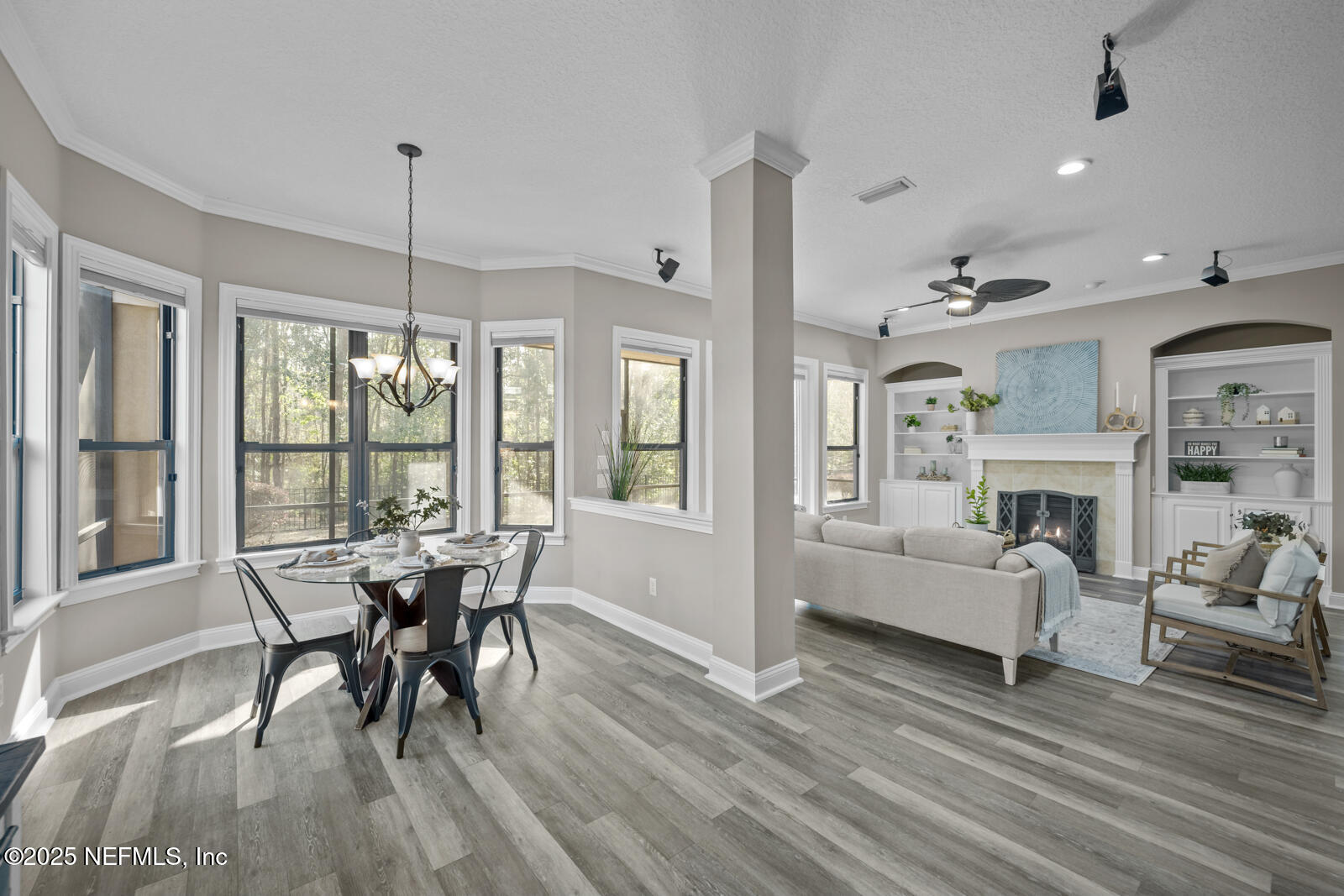 165 St John's Forest Boulevard St. Johns, FL 32259 - Photo 24 of 103 a dining room with furniture a chandelier and wooden floor