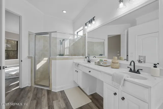 a bedroom with a bed and glass door