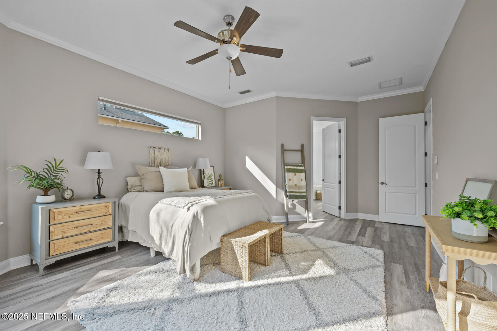 165 St John's Forest Boulevard St. Johns, FL 32259 - Photo 30 of 103 a bed room with a bed and a potted plant