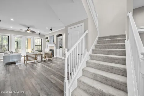 a view of a house with a yard and garage