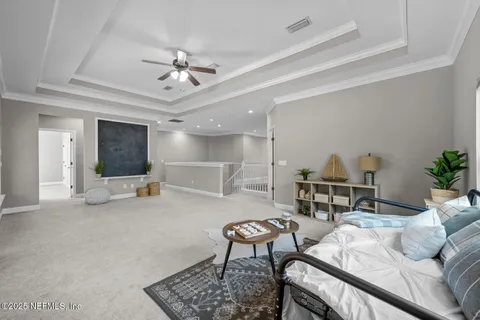 a living room with fireplace furniture and a chandelier