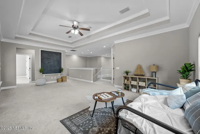 a living room with fireplace furniture and a chandelier