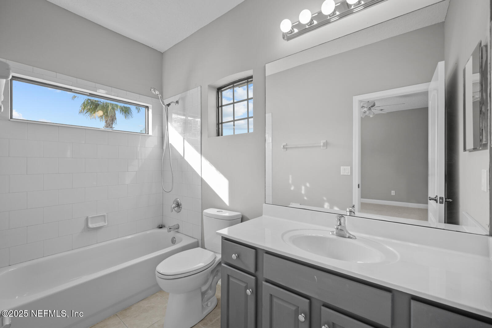 165 St John's Forest Boulevard St. Johns, FL 32259 - Photo 43 of 103 a bathroom with a granite countertop sink toilet a large mirror a bathtub and shower