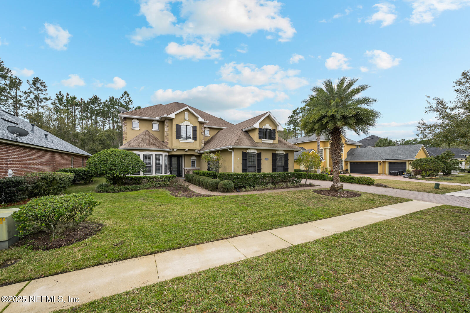 165 St John's Forest Boulevard St. Johns, FL 32259 - Photo 59 of 103 a front view of a house with a garden and trees