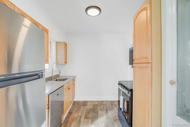 a room with a sink and a mirror