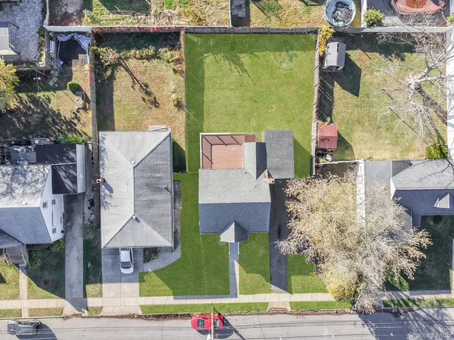 an aerial view of houses with outdoor space