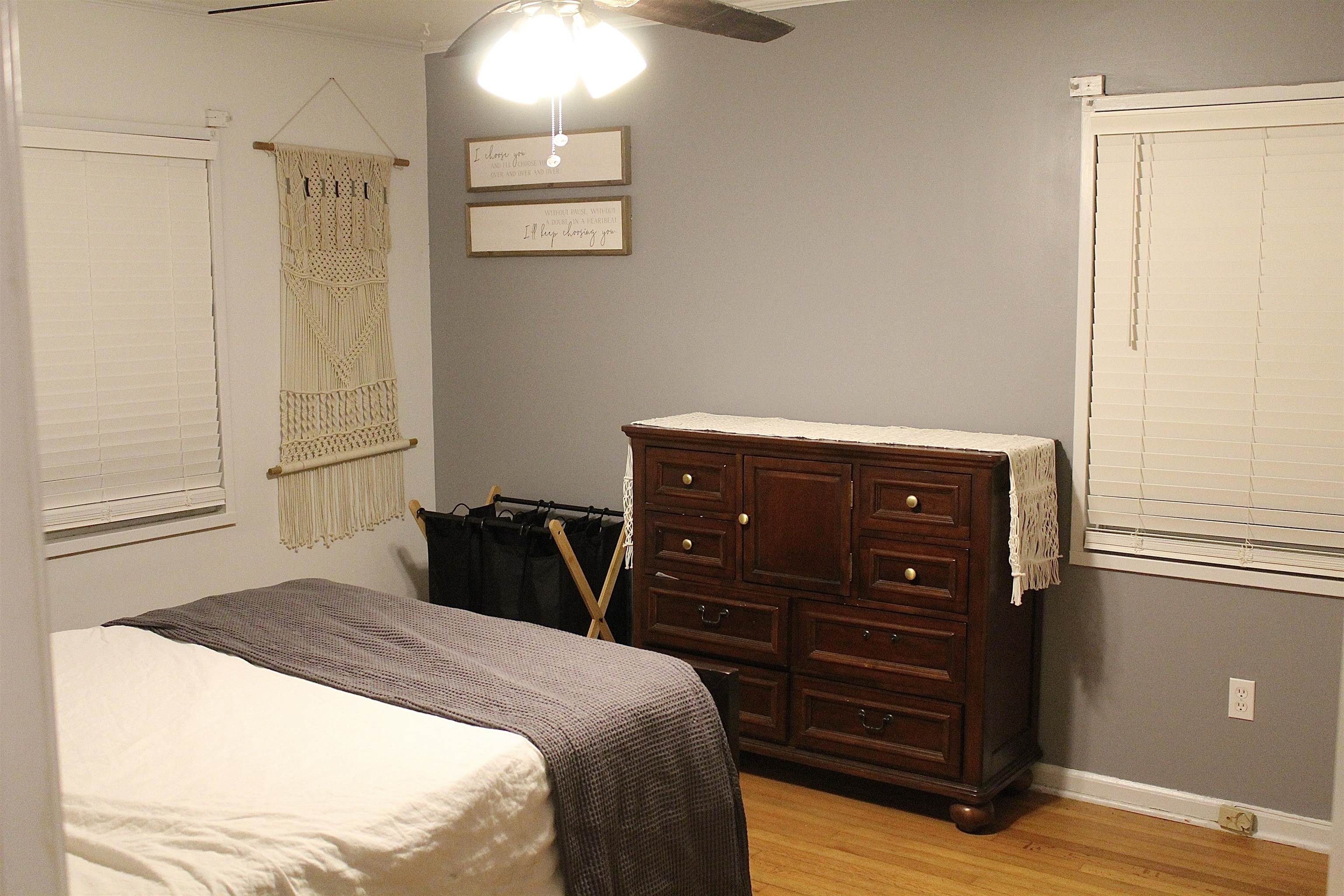 1715 Capri Road Memphis, TN 38117 - Photo 13 of 18 a bedroom with a bed and a dresser