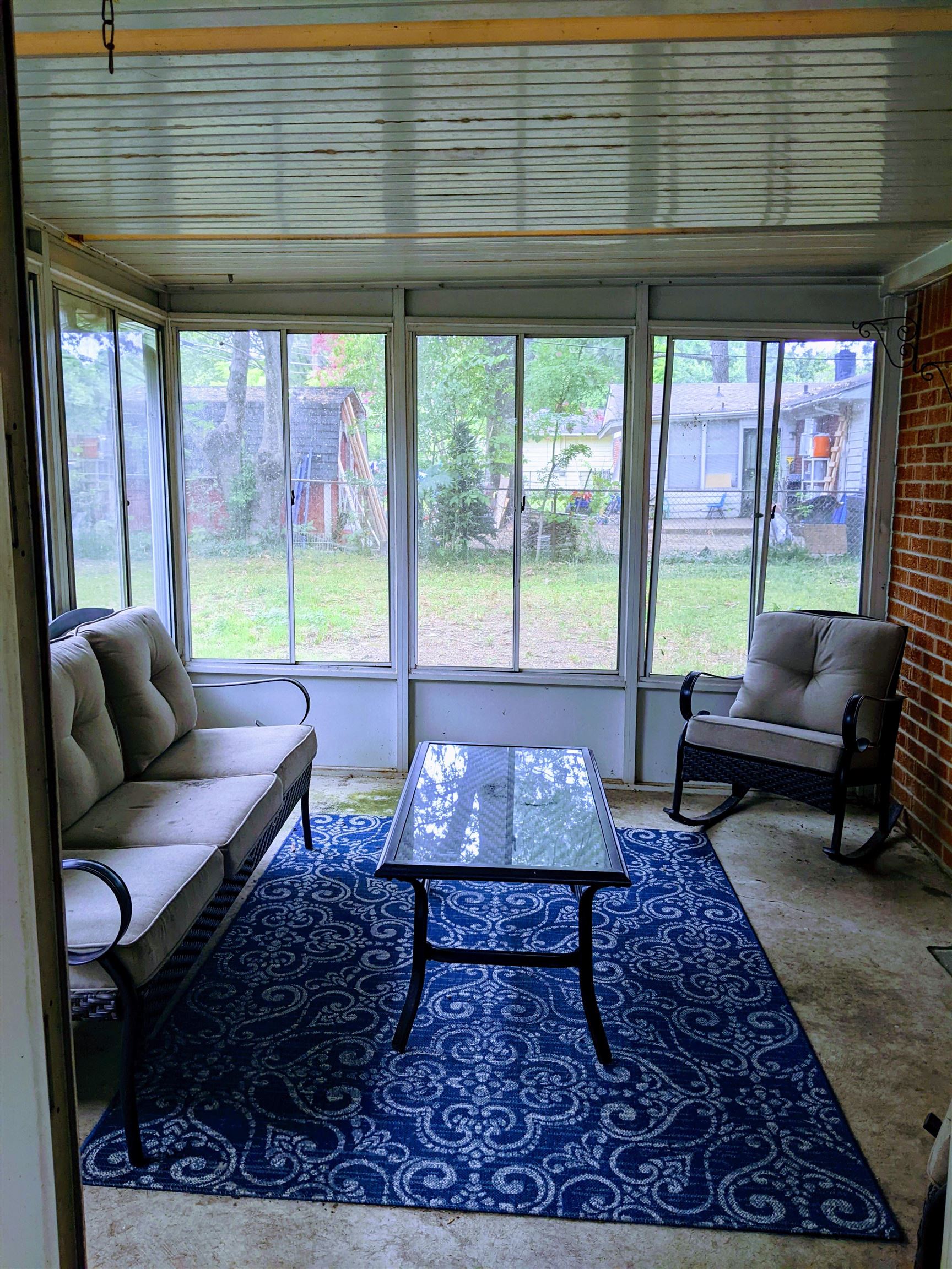 1715 Capri Road Memphis, TN 38117 - Photo 17 of 18 a living room with furniture and a large window