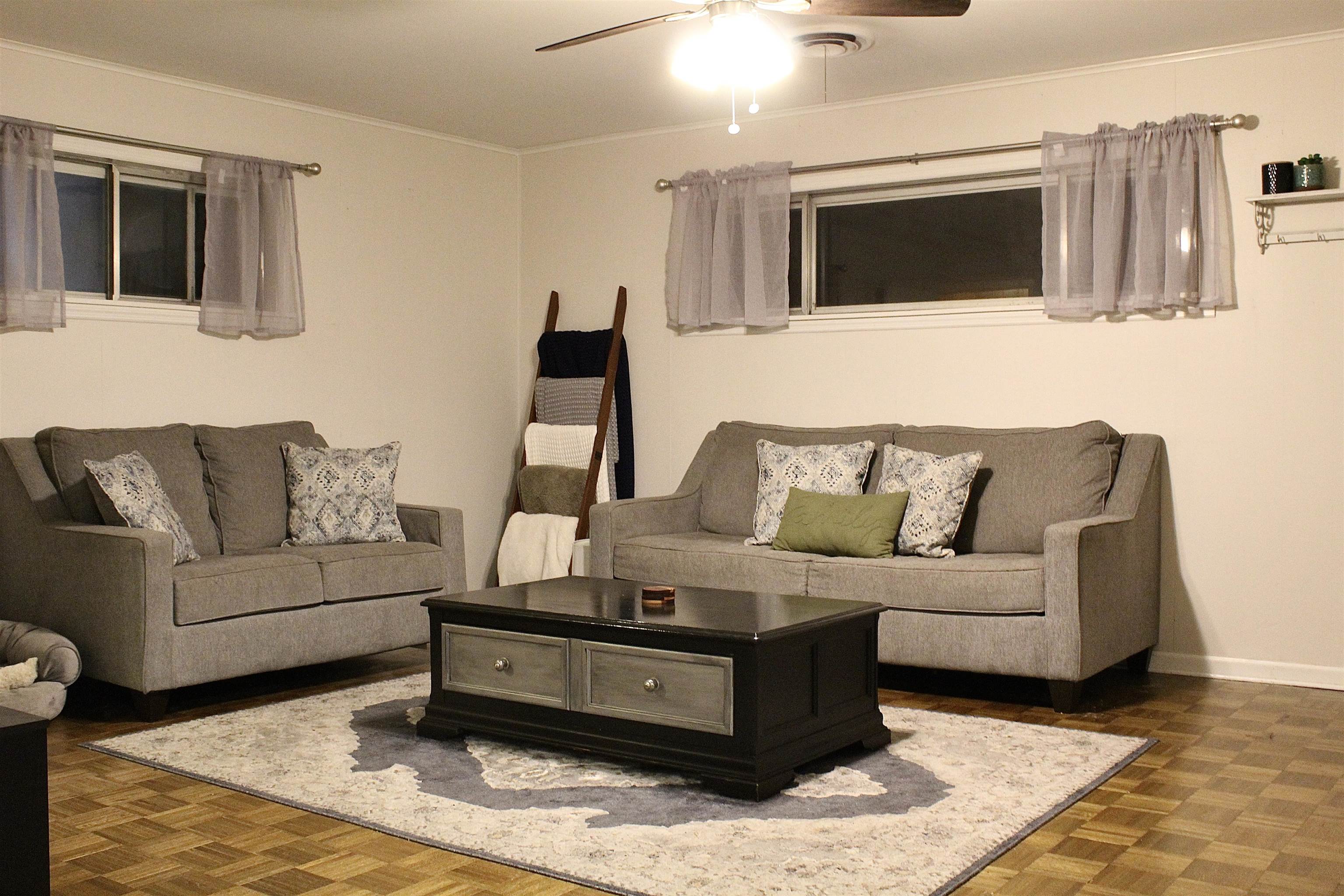 1715 Capri Road Memphis, TN 38117 - Photo 9 of 18 a living room with furniture and a flat screen tv