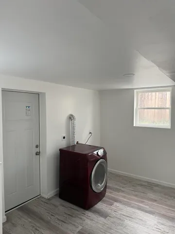 a utility room with a sink dryer and washer