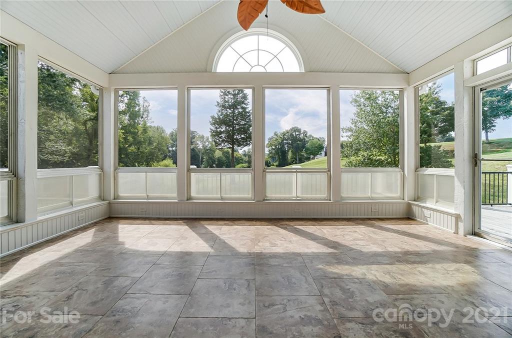 15922 Hollingbourne Road Huntersville, NC 28078 - Photo 17 of 48 a view of an empty room with a window and a swimming pool