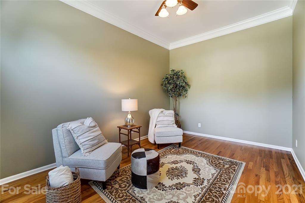 15922 Hollingbourne Road Huntersville, NC 28078 - Photo 26 of 48 a living room with furniture and a rug