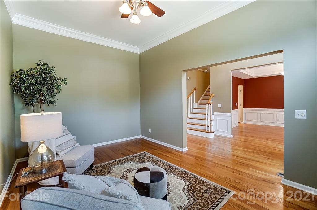 15922 Hollingbourne Road Huntersville, NC 28078 - Photo 27 of 48 a living room with furniture and a potted plant