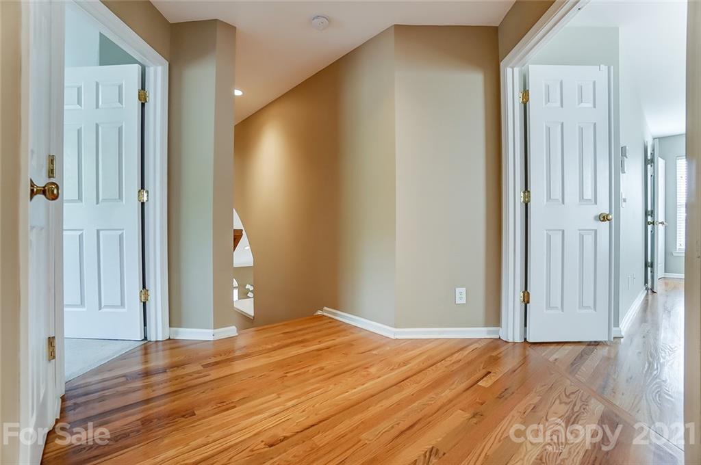 15922 Hollingbourne Road Huntersville, NC 28078 - Photo 28 of 48 a view of a livingroom with wooden floor and door