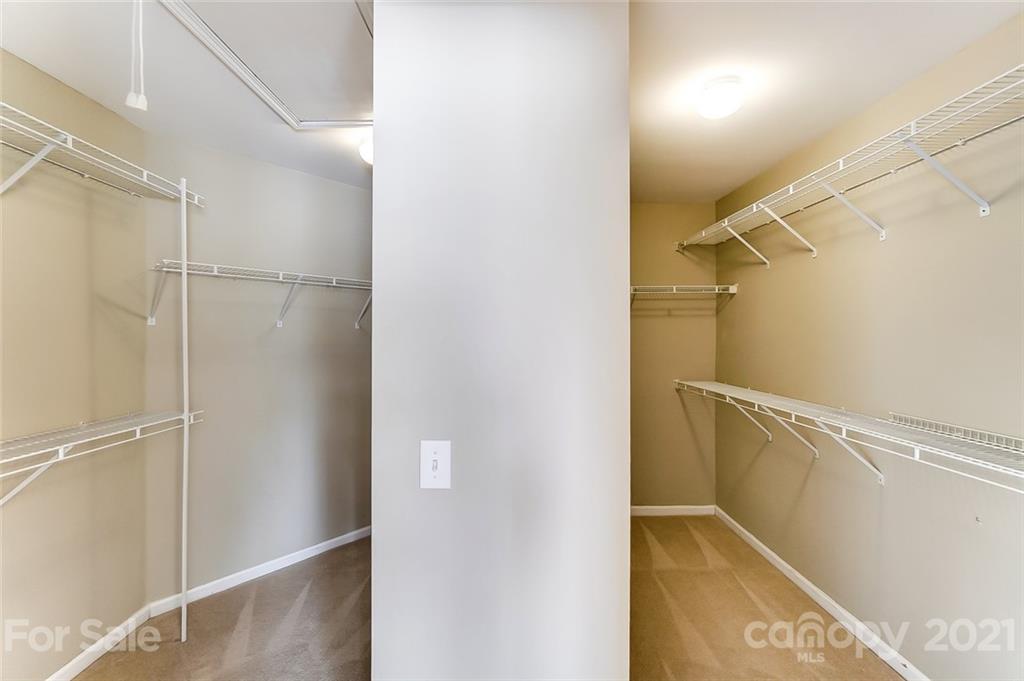 15922 Hollingbourne Road Huntersville, NC 28078 - Photo 33 of 48 a view of walk in closet with empty racks