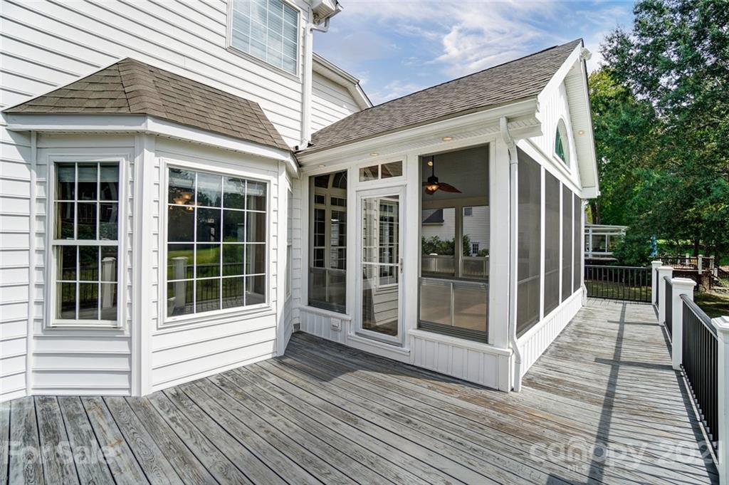 15922 Hollingbourne Road Huntersville, NC 28078 - Photo 38 of 48 a view of a house with a large window and wooden floor and fence