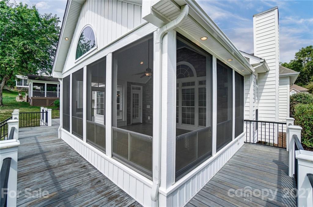 15922 Hollingbourne Road Huntersville, NC 28078 - Photo 39 of 48 a view of a balcony with a large window and wooden floor